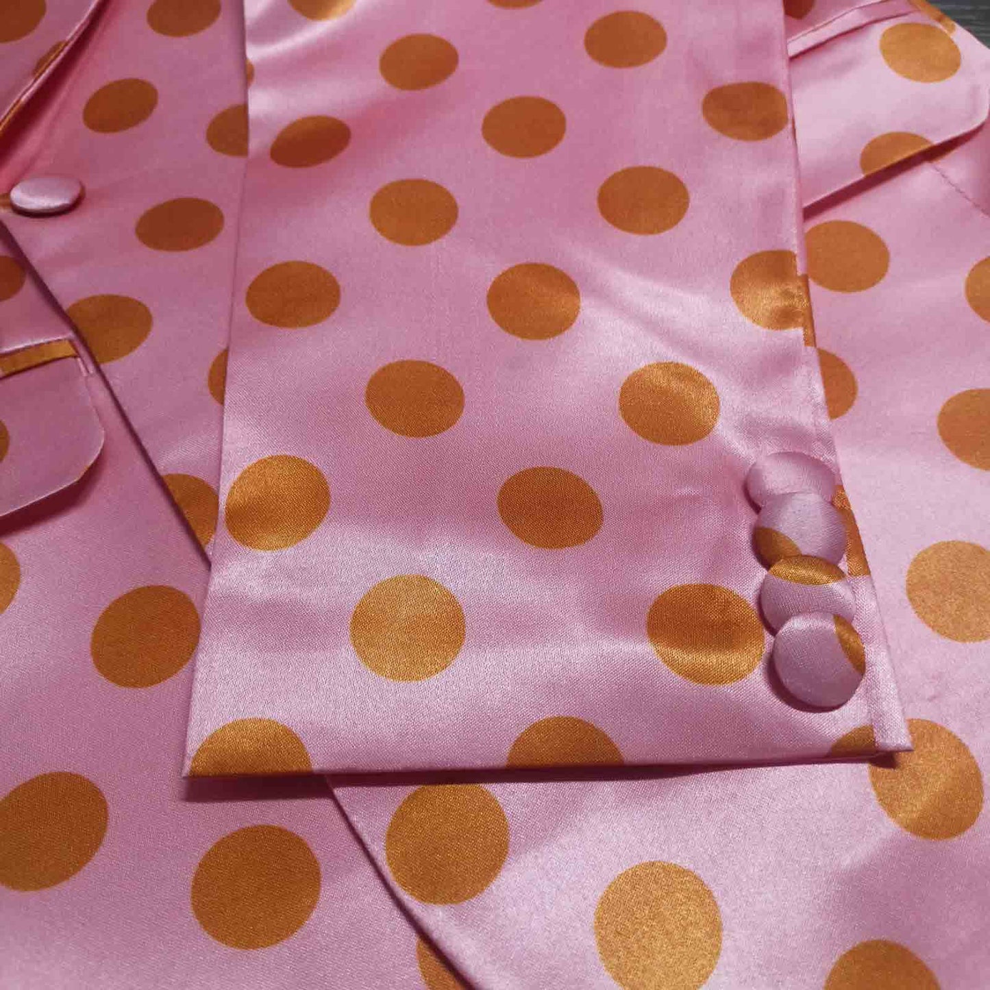 Detail shot of pink orange polka dot blazer lapel - ARTSAY