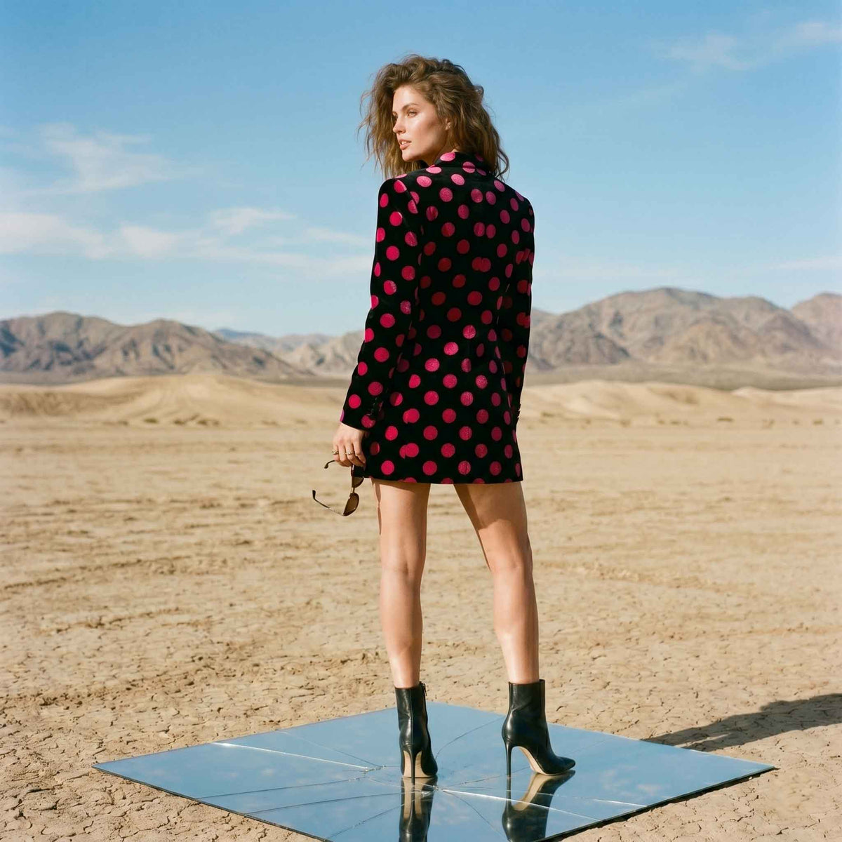 Close-up of polka dot pattern on black velvet blazer - ARTSAY