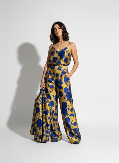 Woman wearing blue and gold printed suit, styled look - ARTSAY