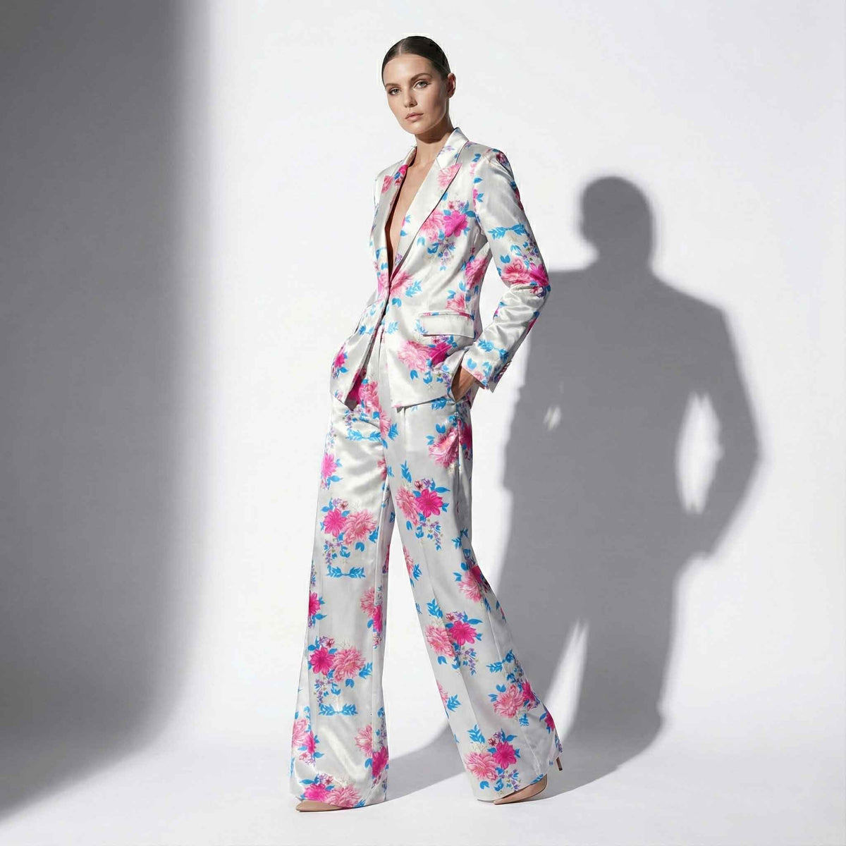 Woman wearing blue and pink floral print pant suit, styled look - ARTSAY