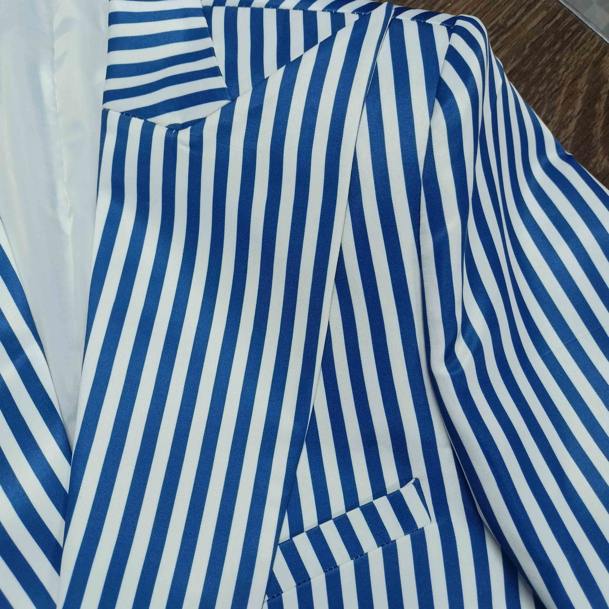 Detail shot of striped blazer lapel and buttons - ARTSAY