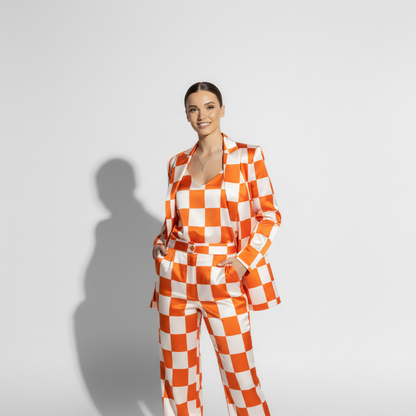 Woman wearing checkered print pant suit, styled look - ARTSAY