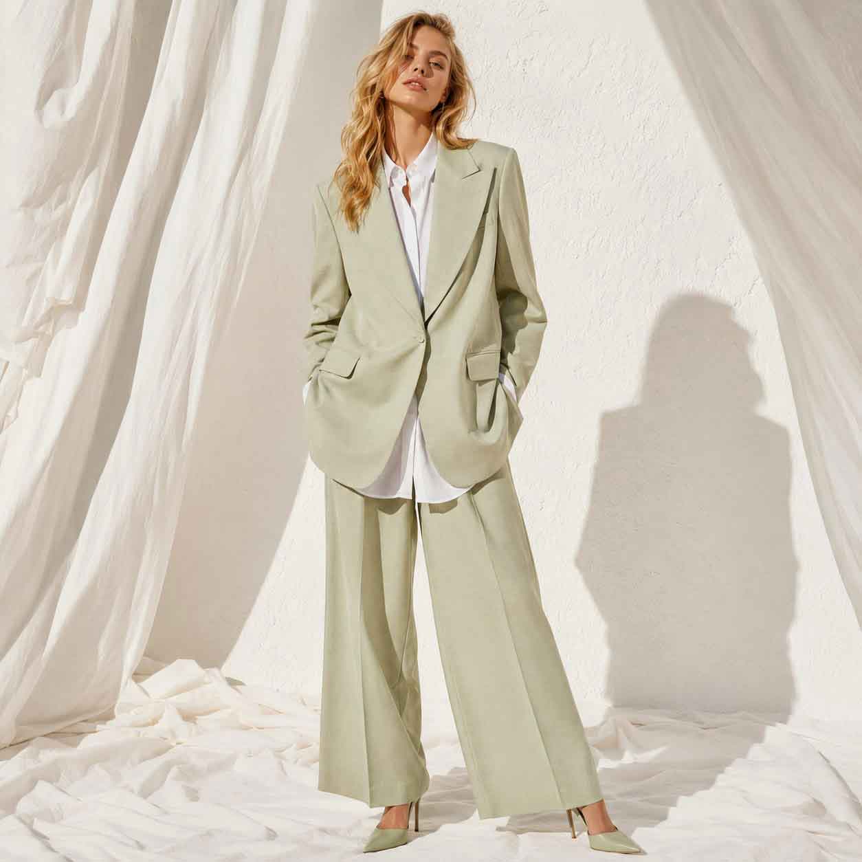 Close-up of green linen blend blazer fabric - ARTSAY