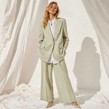 Close-up of green linen blend blazer fabric - ARTSAY