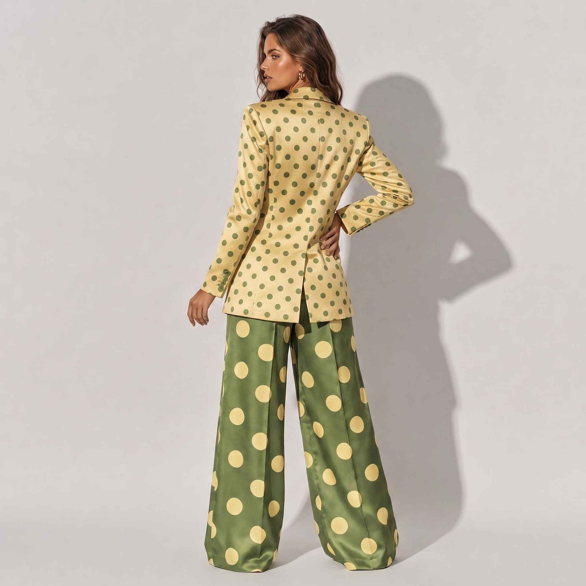 Close-up of polka dot pattern on olive blazer - ARTSAY