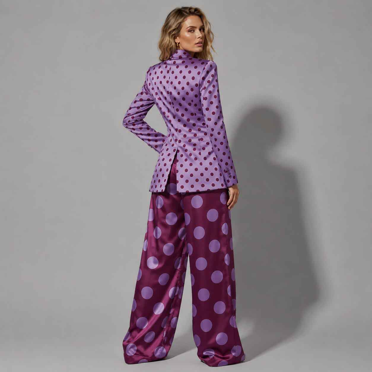 Close-up of polka dot pattern on plum blazer - ARTSAY