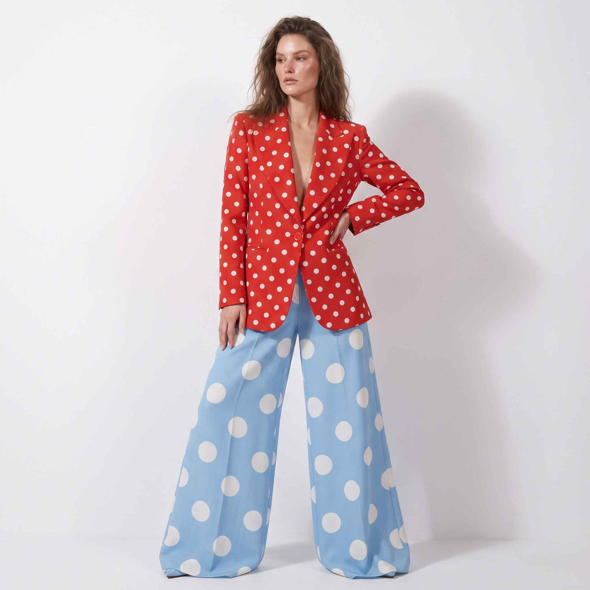 Woman wearing red sky blue polka dot blazer pant suit, styled look - ARTSAY