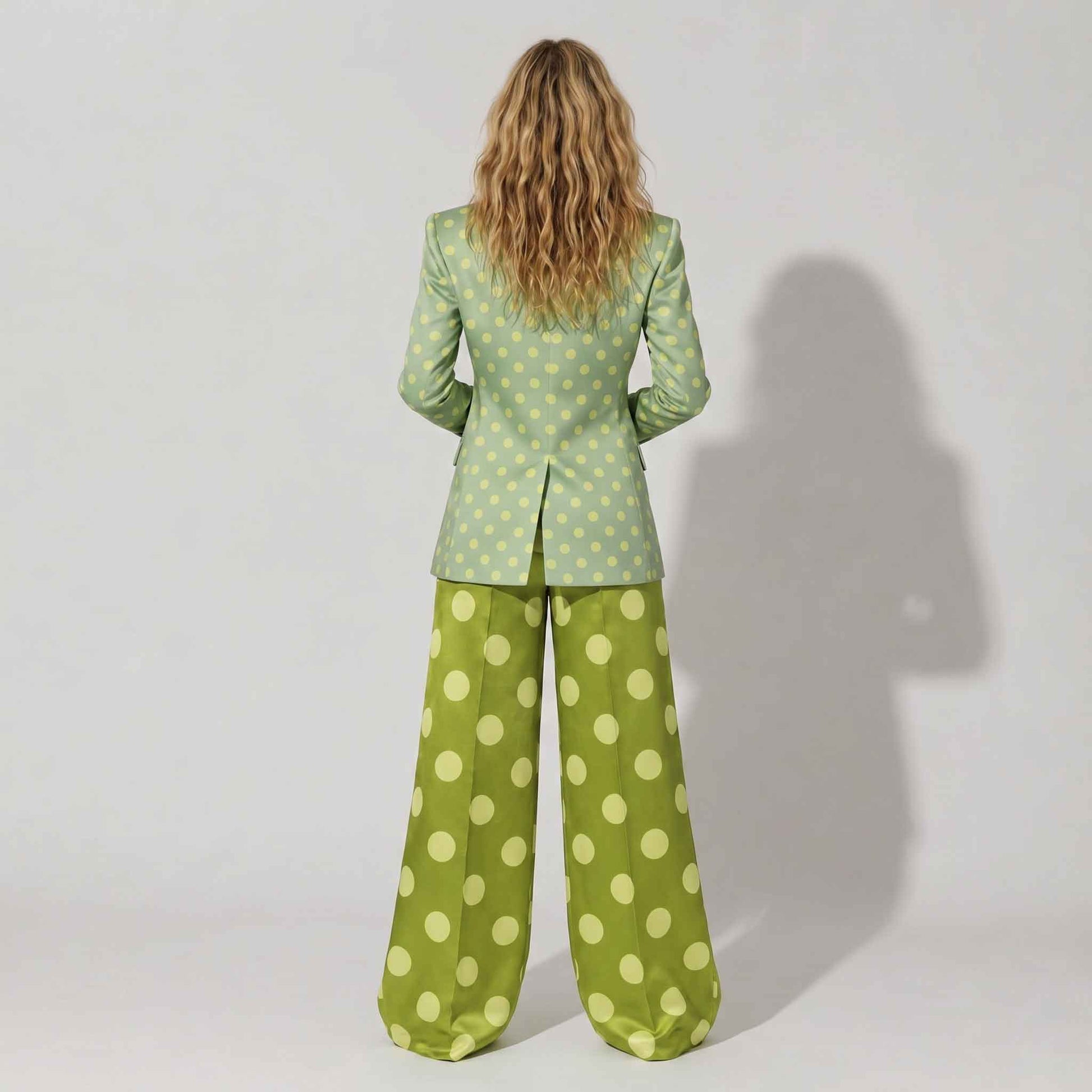 Close-up of polka dot pattern on green blazer - ARTSAY