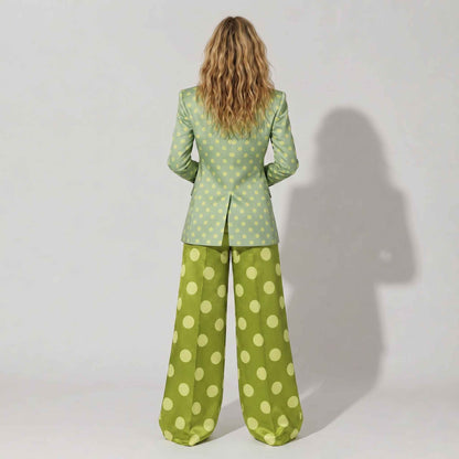 Close-up of polka dot pattern on green blazer - ARTSAY