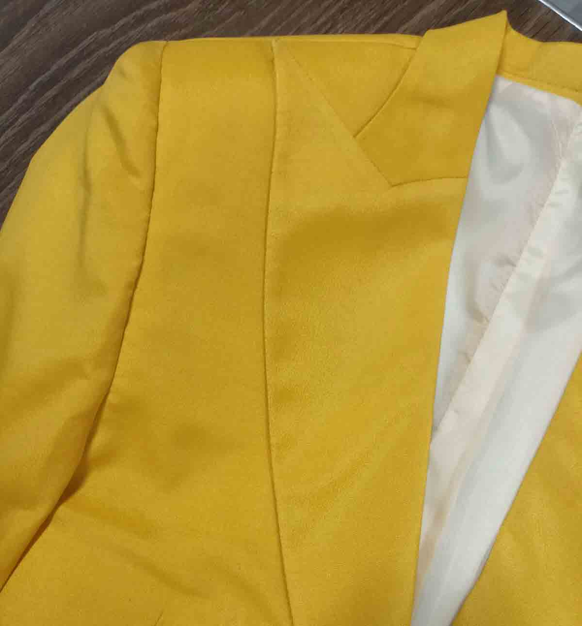 Detail shot of yellow oversized blazer lapel - ARTSAY