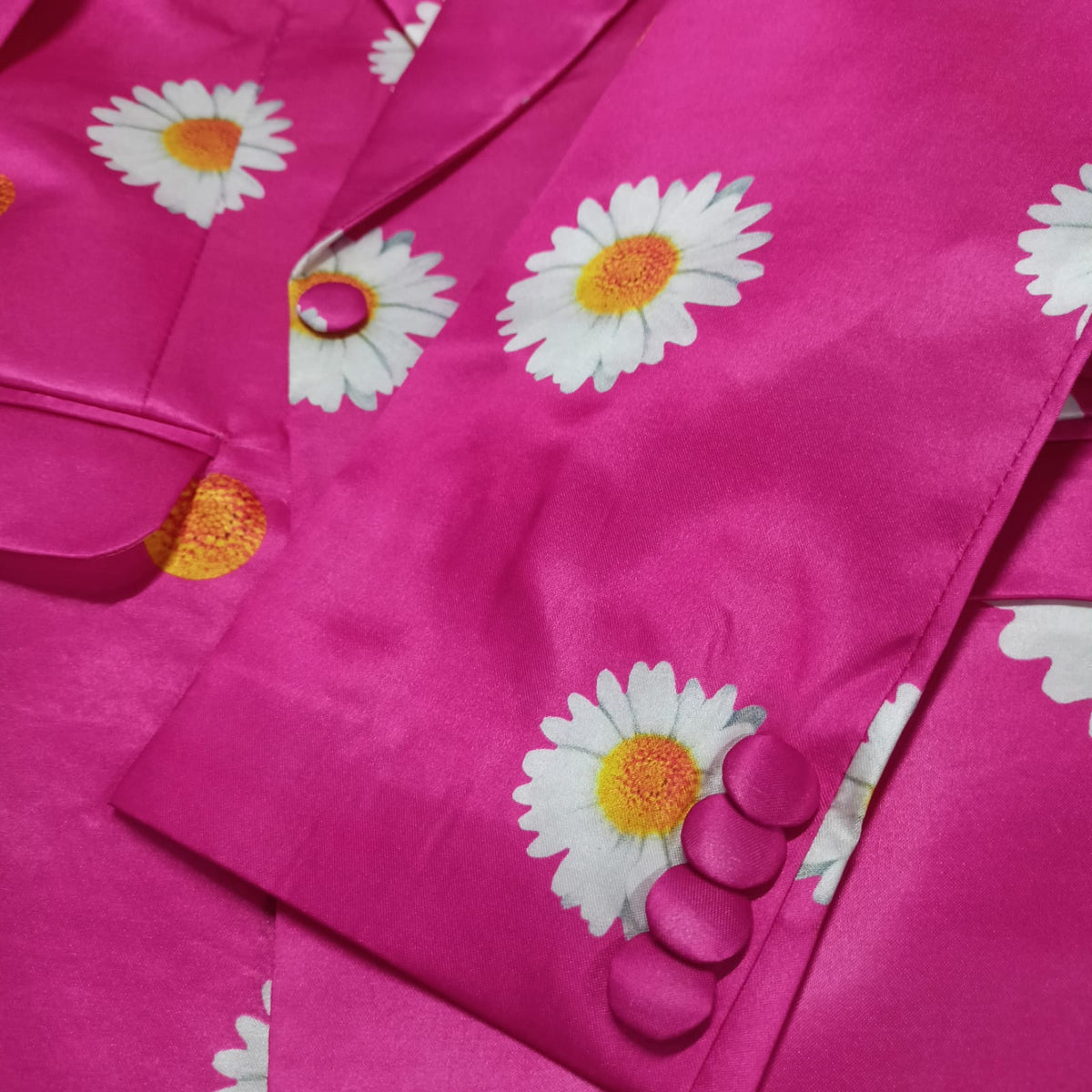 Detail shot of hot pink daisy print blazer lapel - ARTSAY